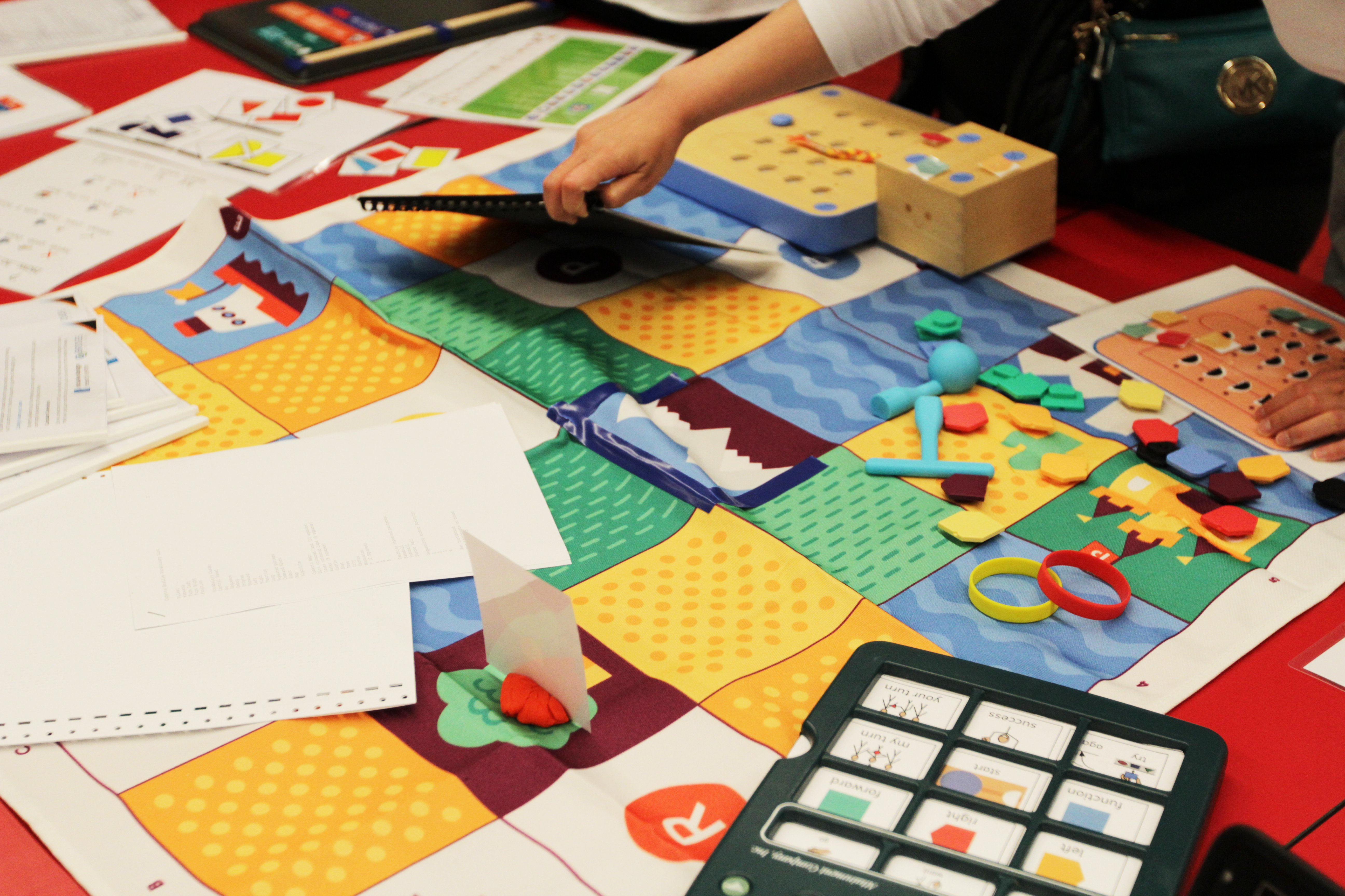 Colourful fabric prototype with different patterns and small shapes around